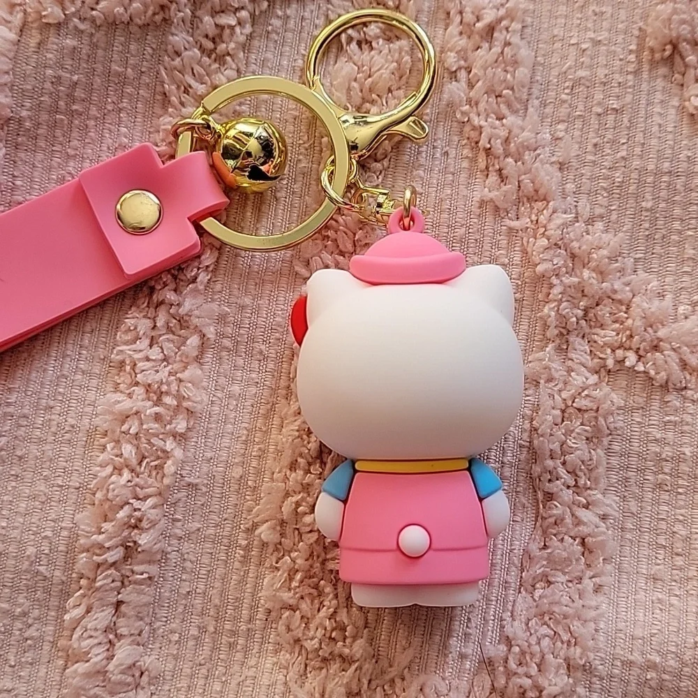 Hello Kitty, silicon keychain. NWOT. Metal hooks, pink and white 💗.